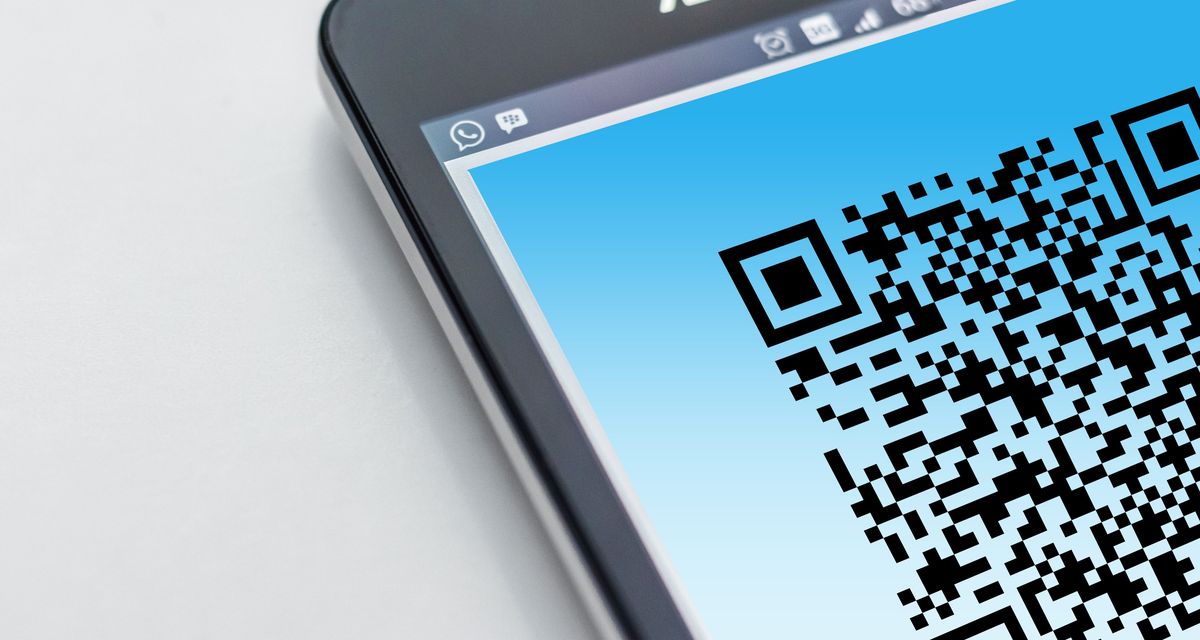 A QR code filling the screen of a phone