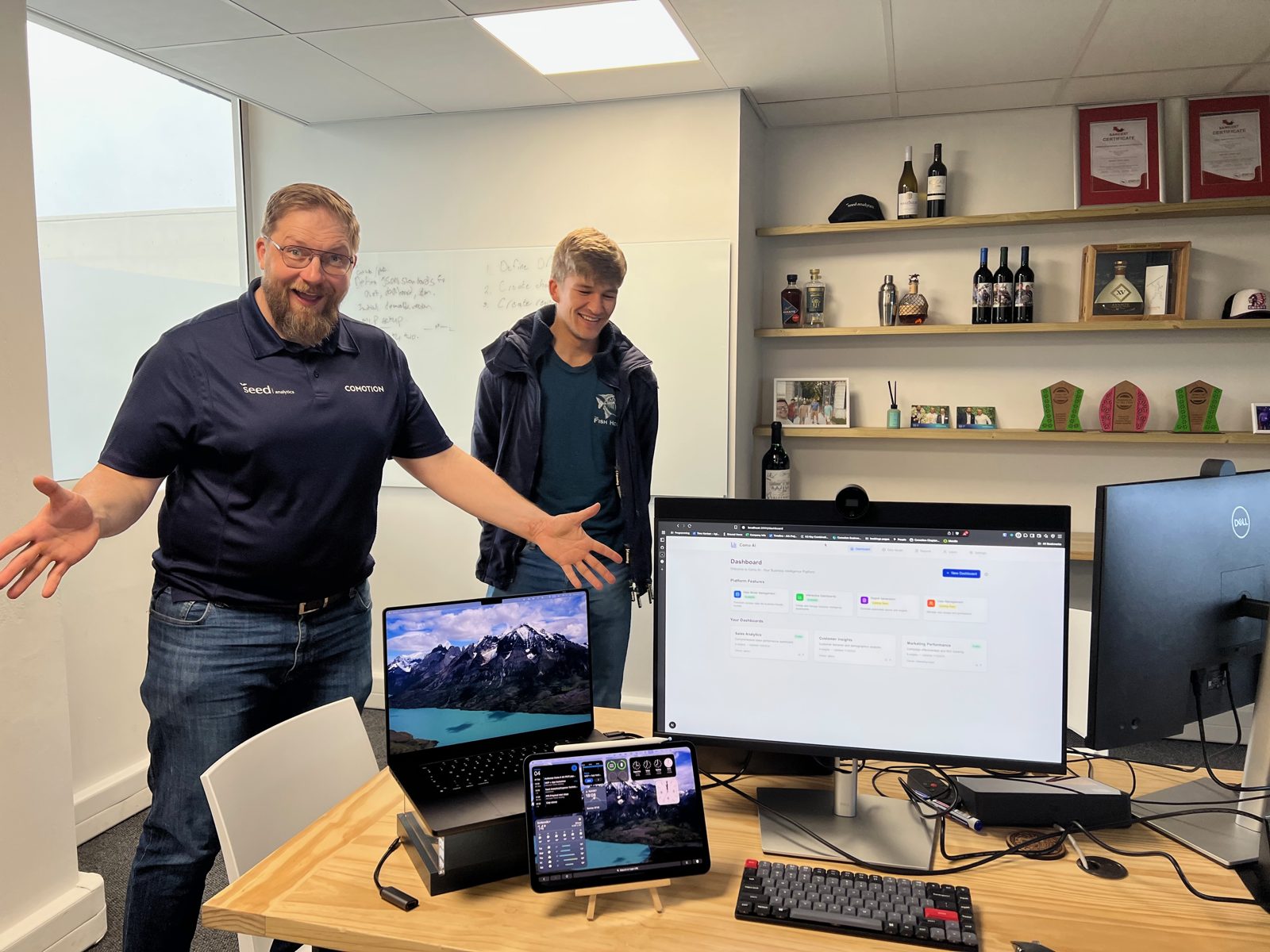 A new dual-monitor desk setup being handed over to the people who will use it