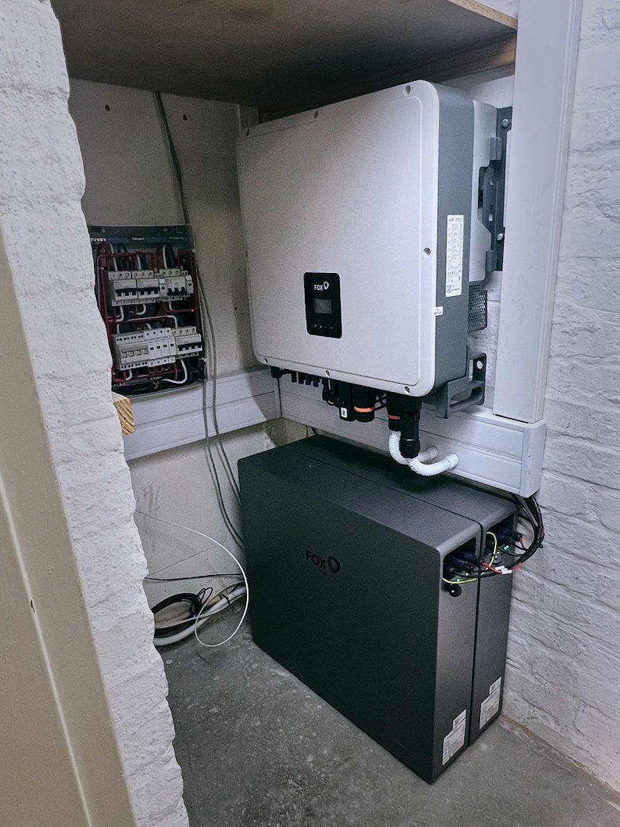 A wall-mounted network cabinet with equipment and backup power
